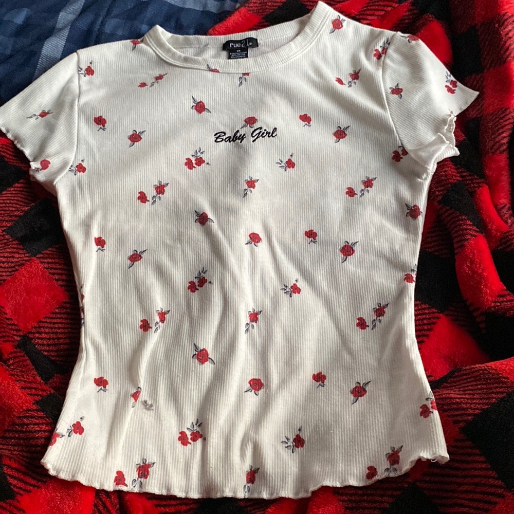 White shirt white red flowers on it also says babygirl rue 21 brand size xs